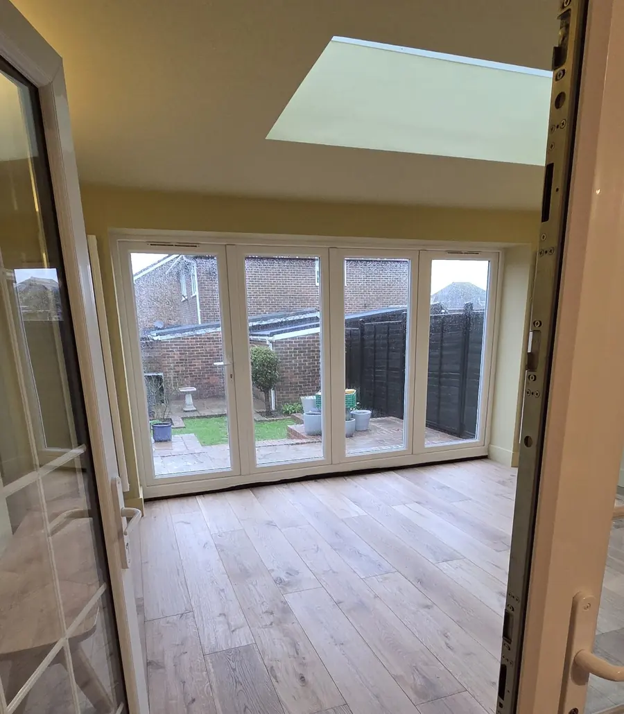 View through French doors into the new extension and out to the garden