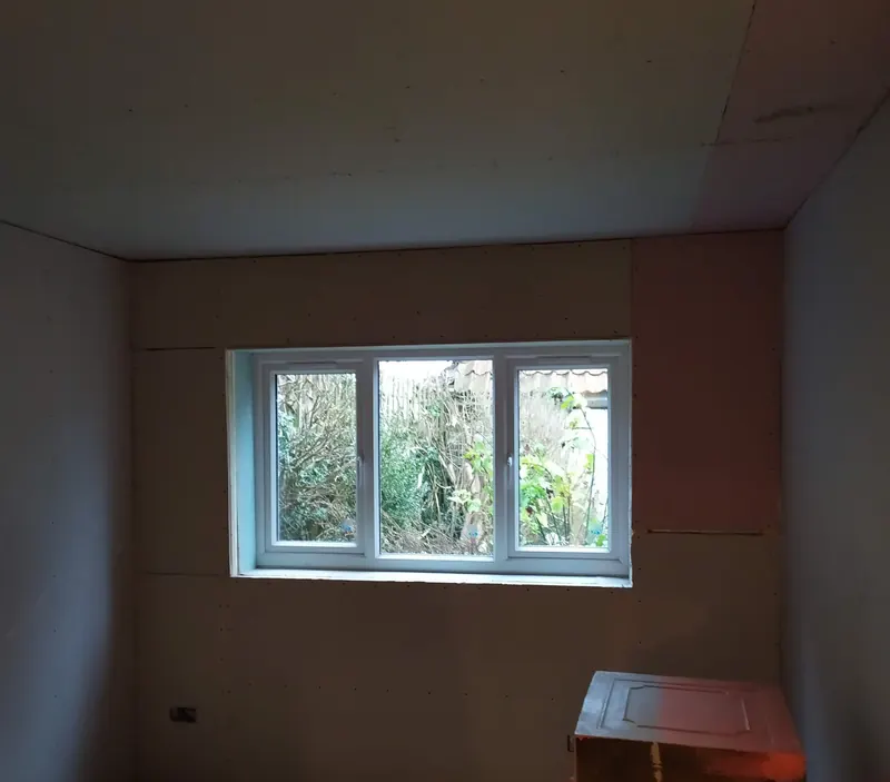 Garage insulated and plasterboarded with a new window fitted